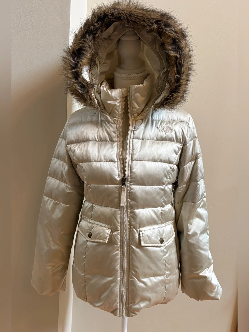 The North Face Girls champagne-colored puffer jacket
